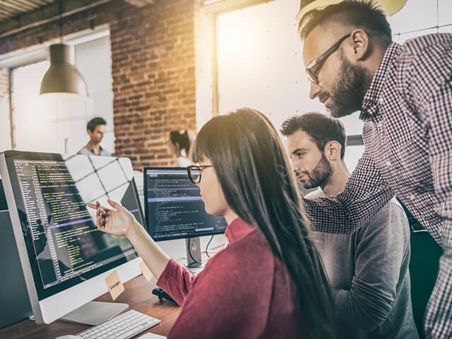 a group reviewing code