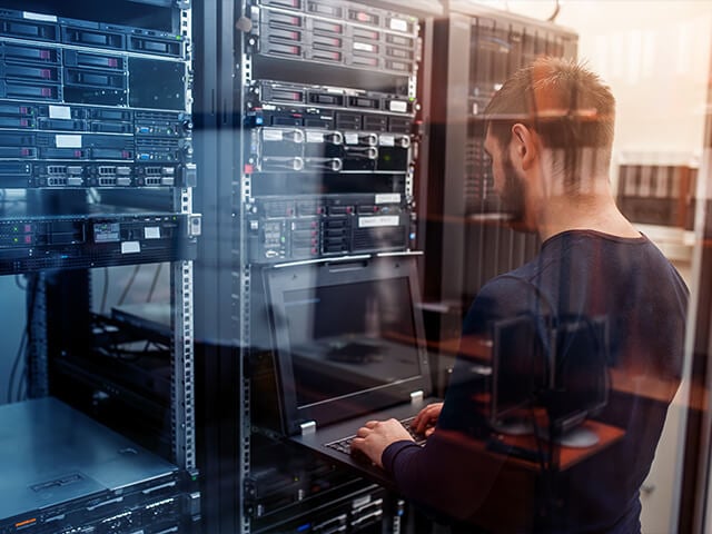 A man reviewing data analytics on his latop