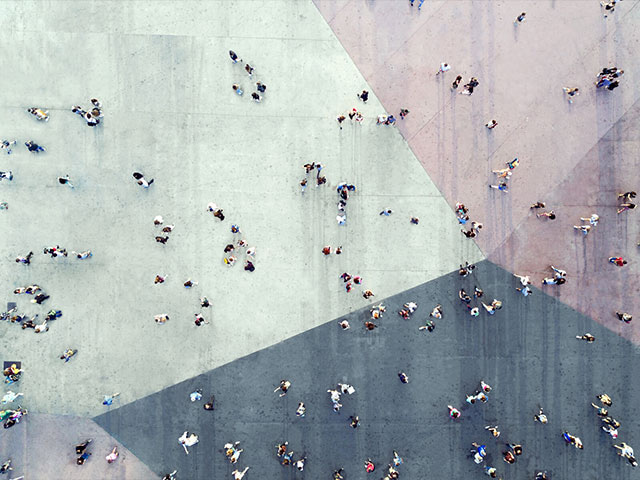 overhead view of crowd of people crossing paths