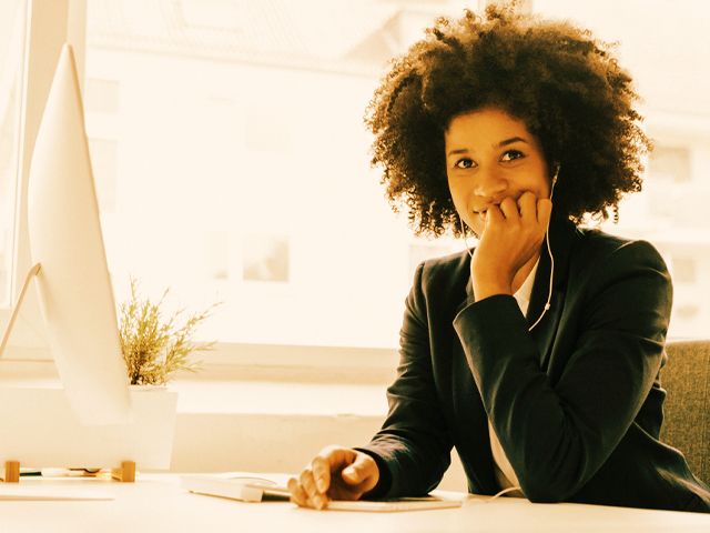 Woman on laptop building a high performance team
