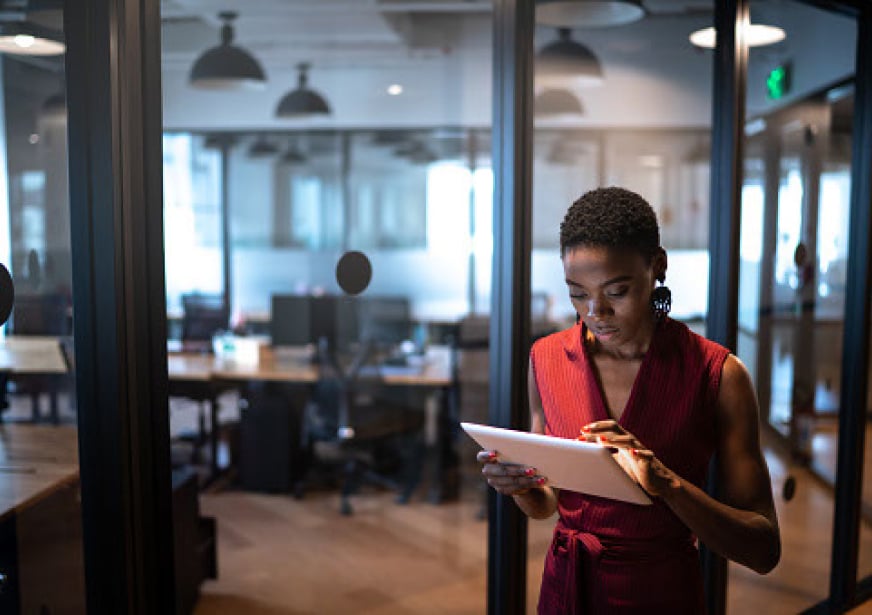 a lady using an iPad in the office