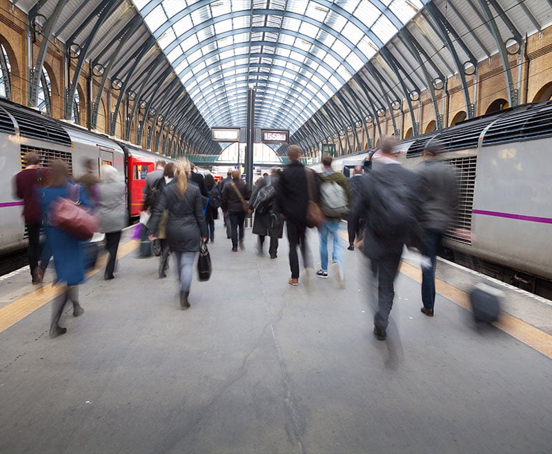 crowd of people finding their way at a train station