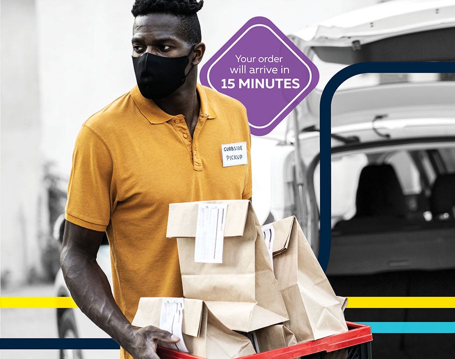 man delivering food curbside for an online order