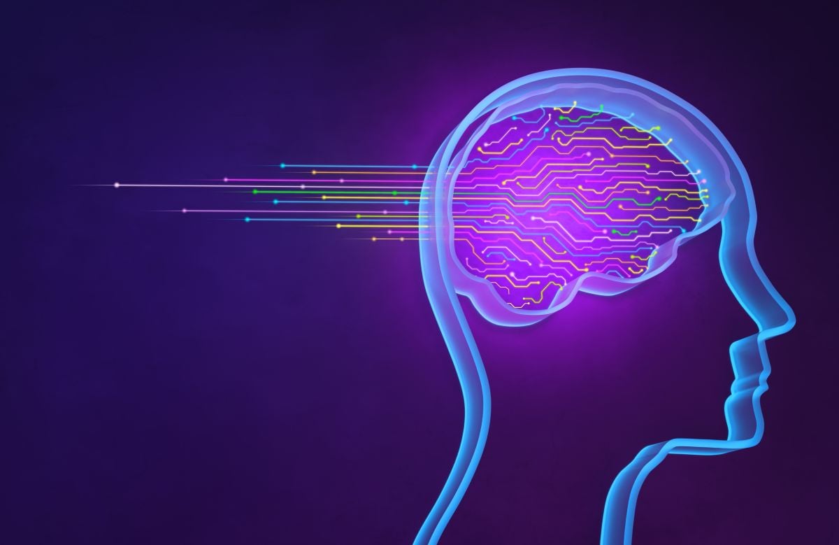 neon head silhouette with digital imagery of a brain inside.