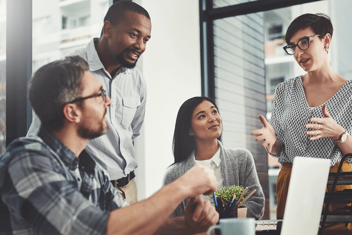 small group of business professionals discussing culture at the office