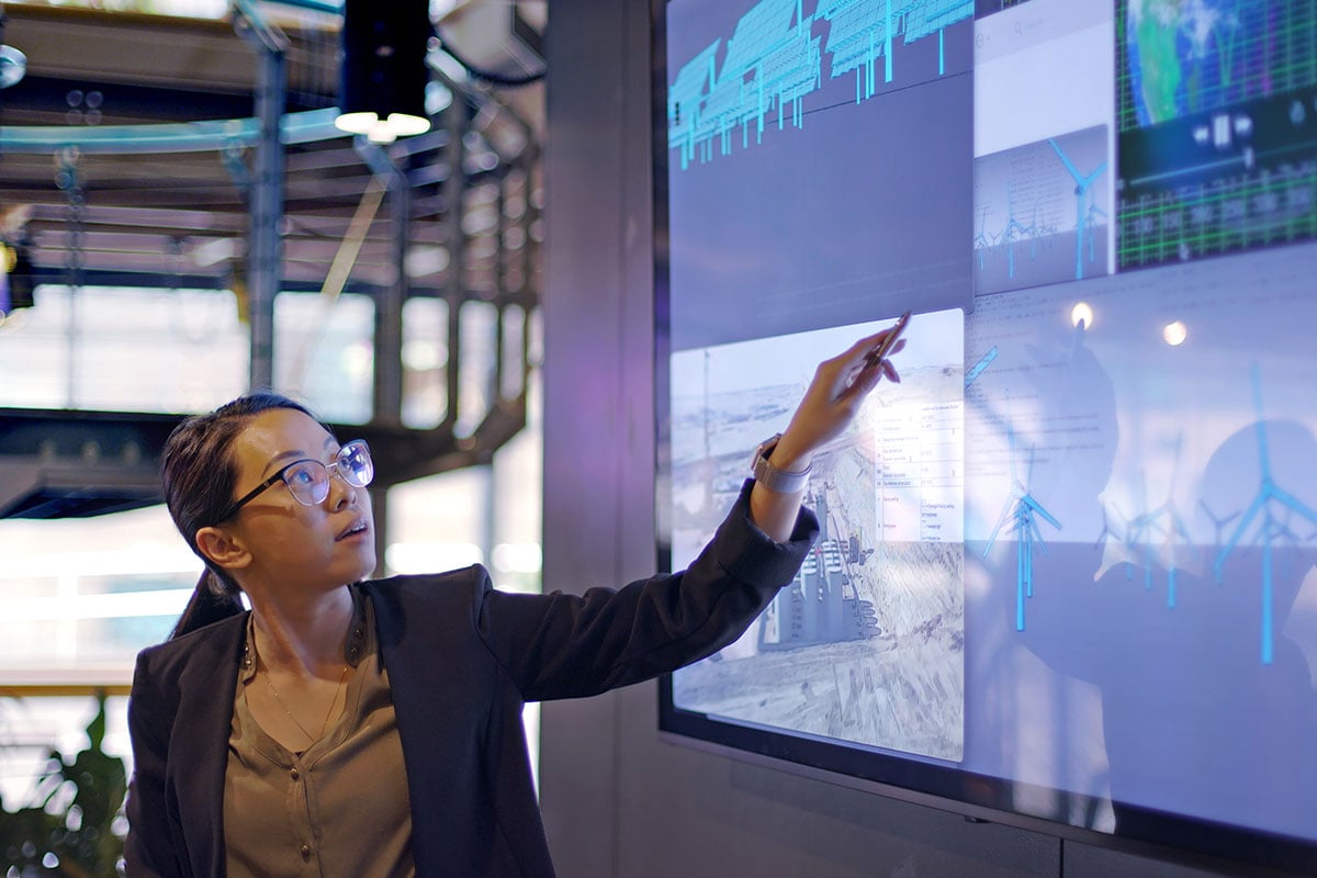 woman standing and presenting data strategy