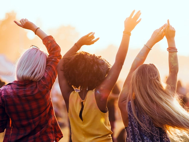 People in an audience dancing