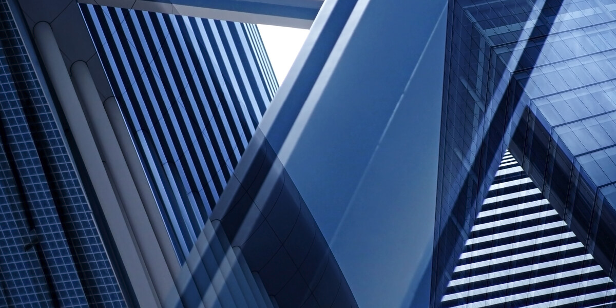 A top view looking up through mmultiple windows in a building