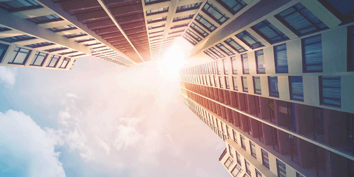 Looking up at a building with the sun shining down