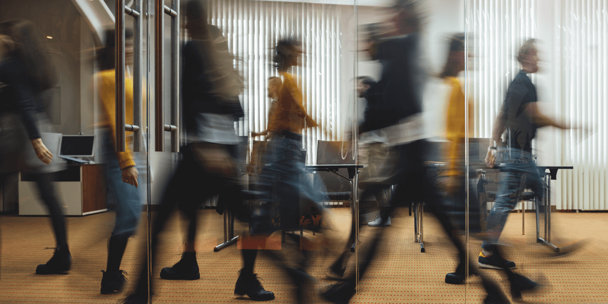 Blurred diverse people walking