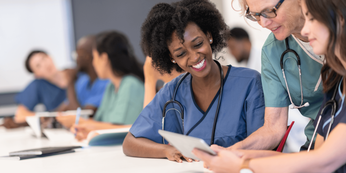 healthcare technology consultation in a classroom setting with healthcare profressionals