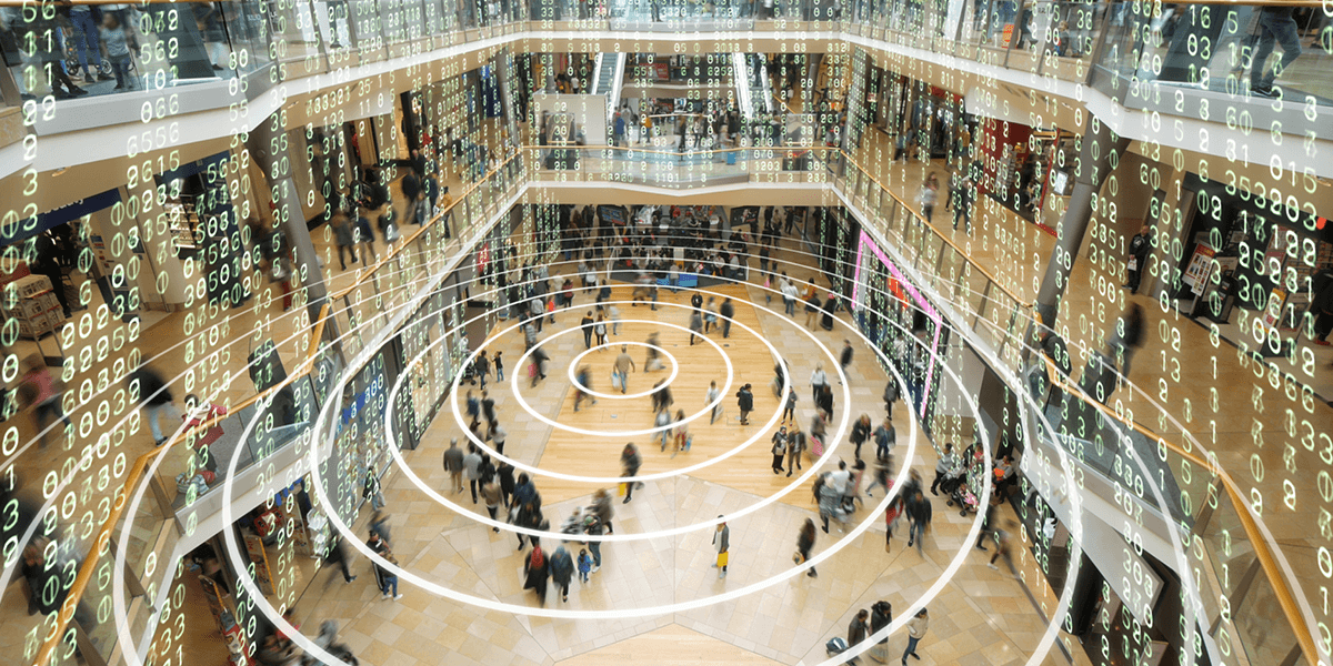 A mall with people walking and data floating above them