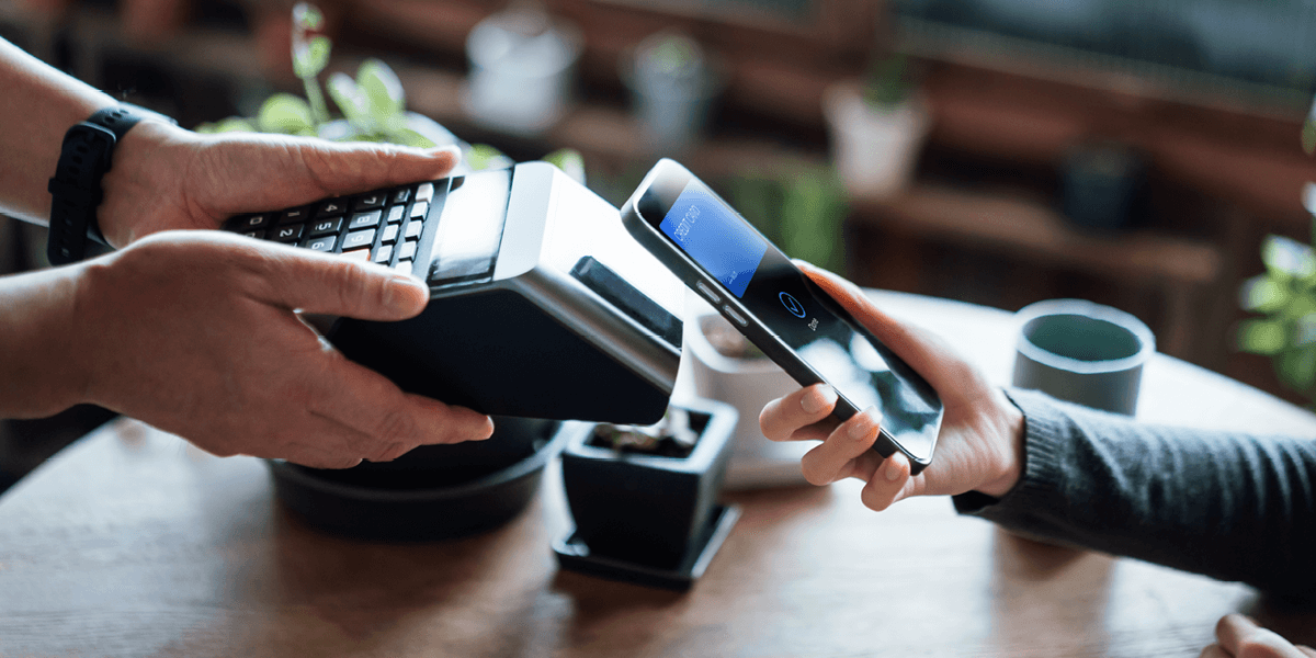 A customer paying using their phone