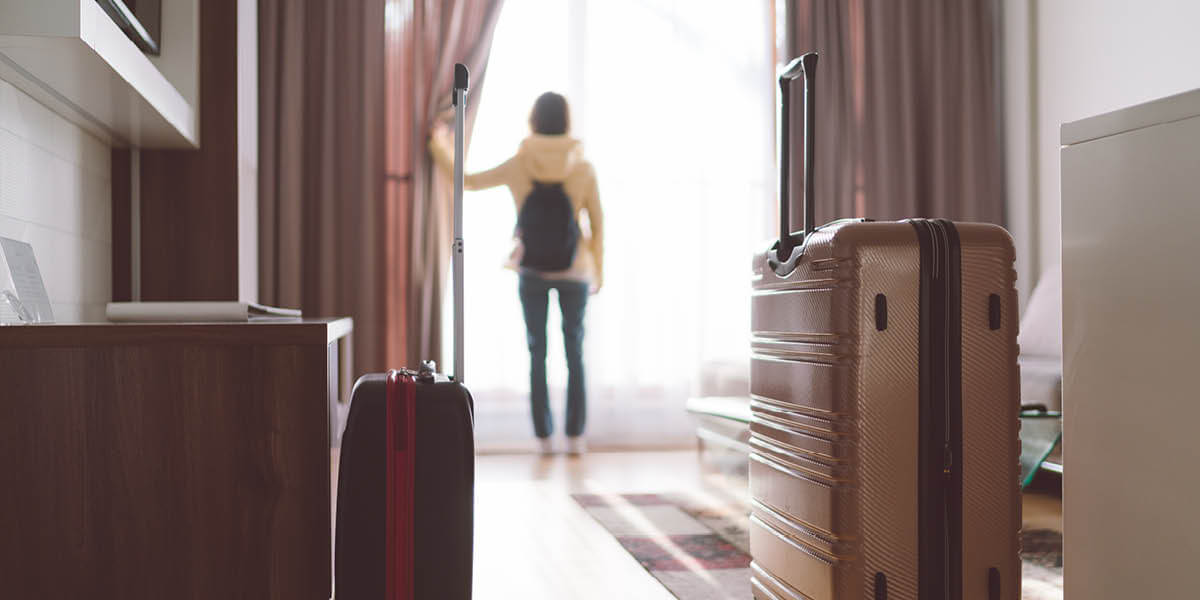 travel industry image of a woman in a highend hotel room.