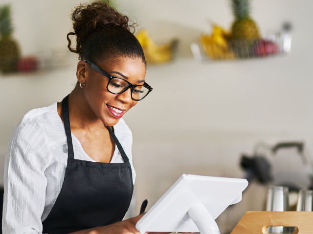 female fast-food employee uses new cloud based POS system