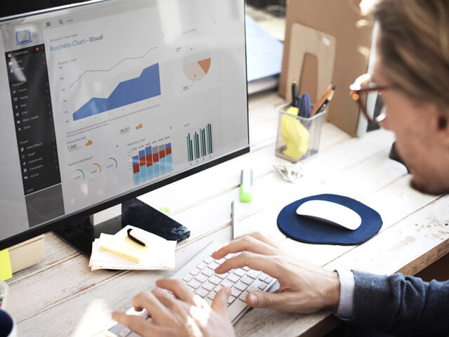 Person studying legacy enterprise integration data at a computer