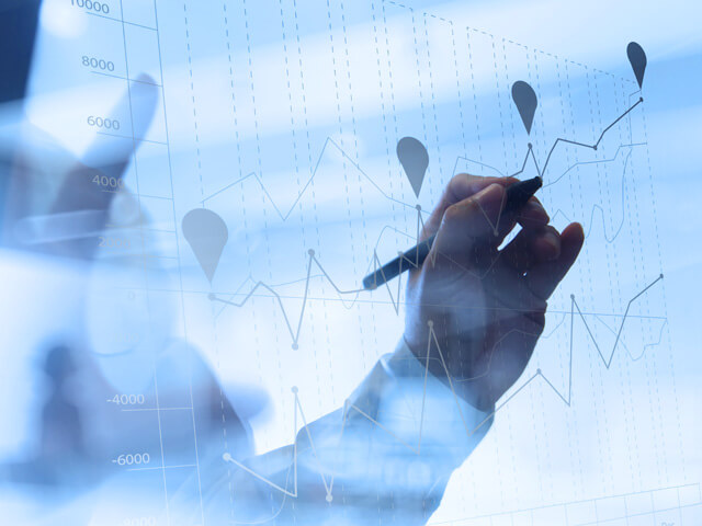 Person charting graphs for legacy portfolio rationalization on a whiteboard