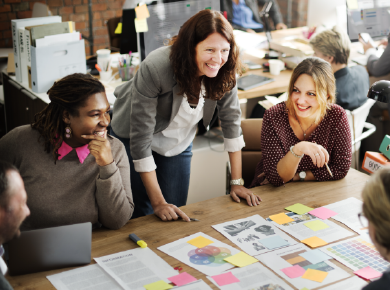 female CMO discussing martech solutions with her team