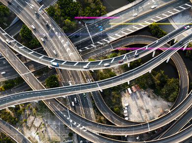 Sky view of intertwining highways with digital connections