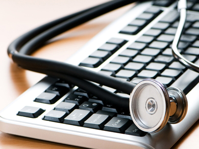 stethoscope rests on a keyboard