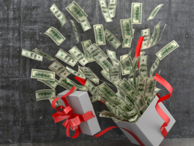 money flying out of a giftbox