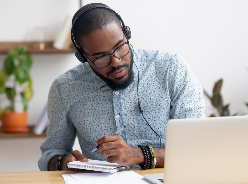 african american young adult using a laop top for microlearning