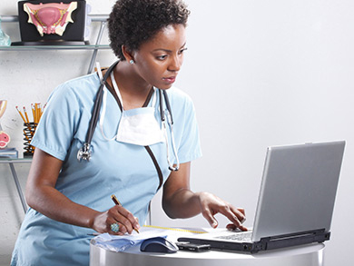 nurse at computer