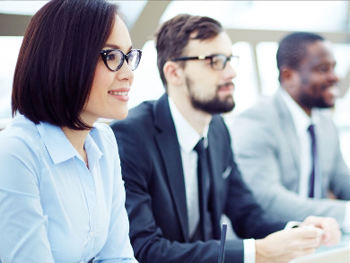 three diverse employees are onboarded during orientation