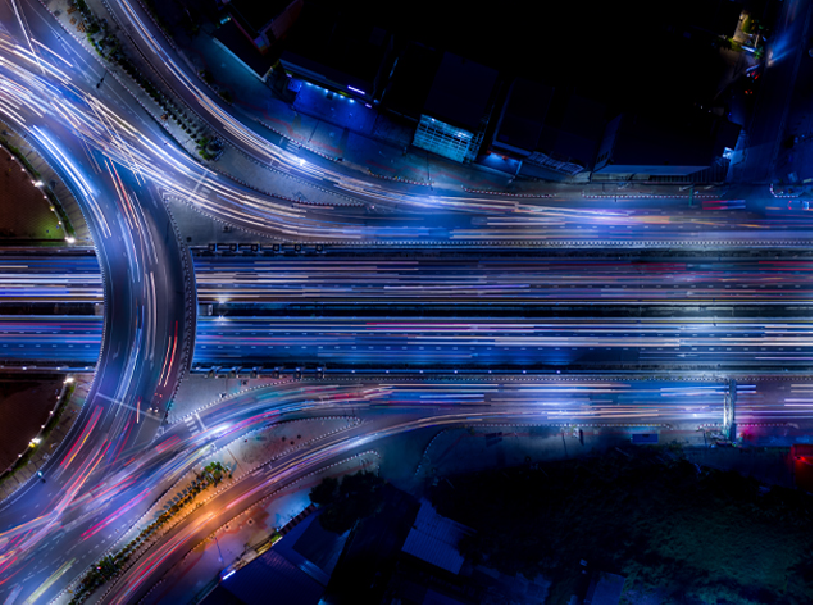scalable Terraform cloud services representated by highway view from above with neon movement.