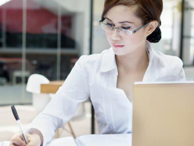 a woman studies for a certification