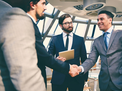 professionals sealing a staffing partnership with a handshake