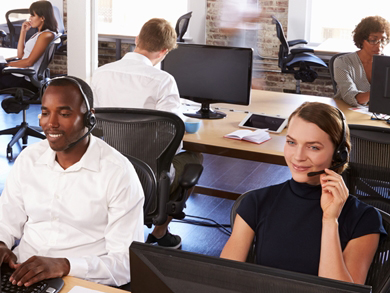 male and female customer service reps on headsets