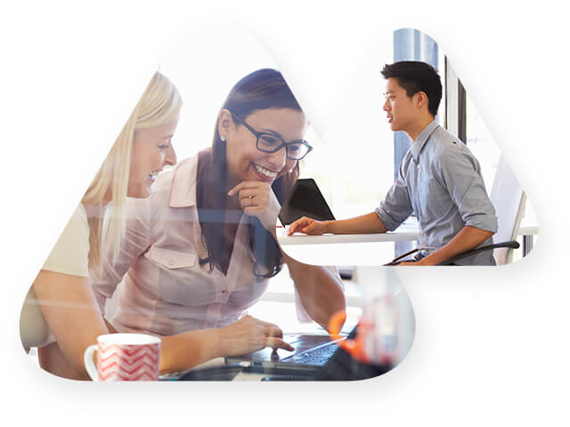 large triangle showing two smiling women working on a laptop and small triangle contains a man working on a desktop