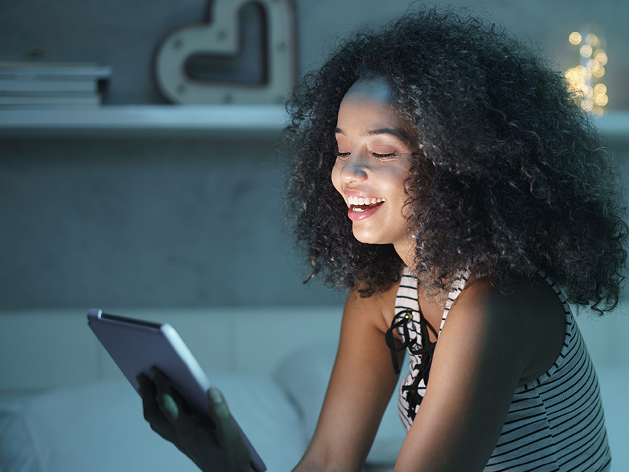Woman enjoying user experience on her tablet
