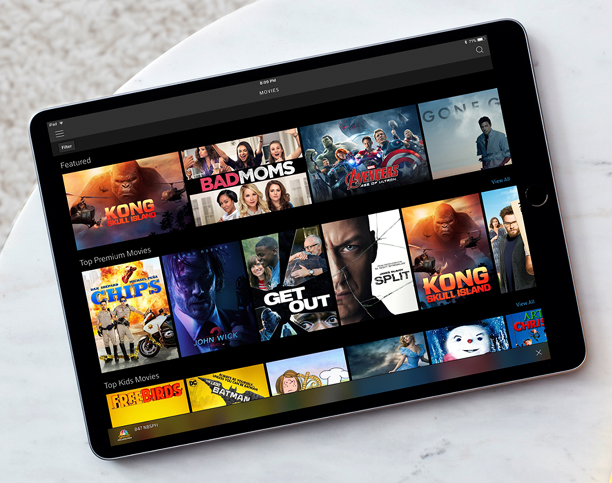 Sample of Comcast's communication services illustrated as video, wireless, news and entertainment on a high-speed tablet