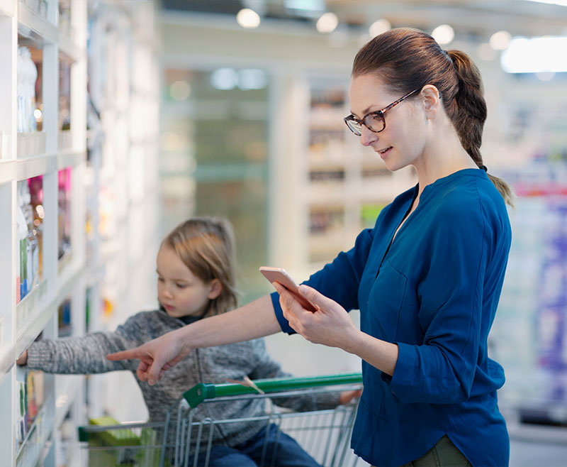 woman shopping with child using artificial intelligence to help her make decisions faster