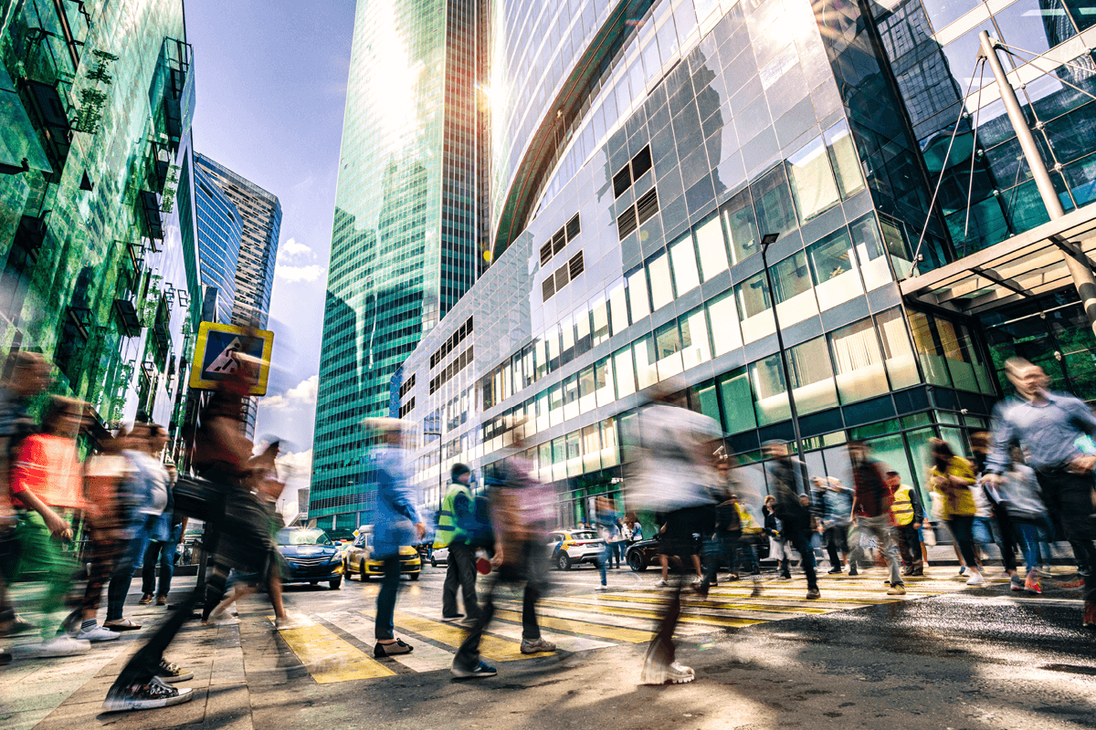 busy city street with only the background buildings in focus.