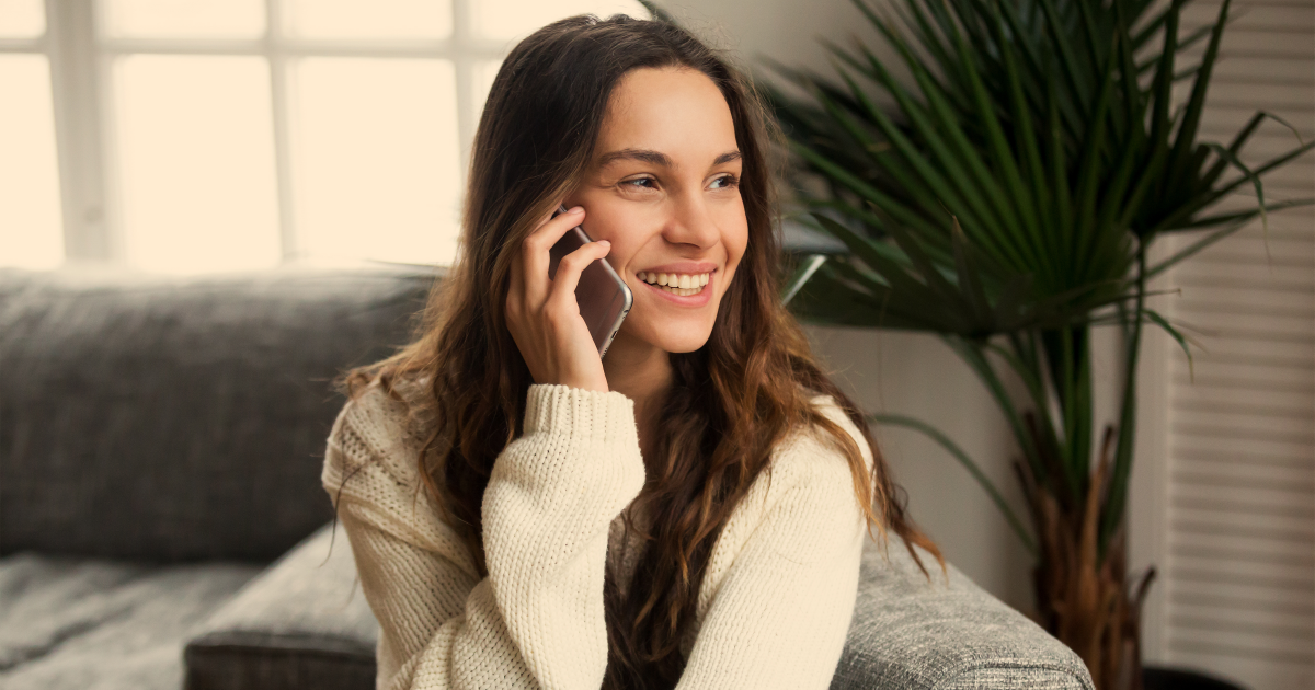 young woman using 5g cell phone