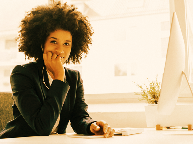 Woman on laptop building a high performance team
