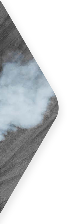 race car burns rubber causing smoke on road