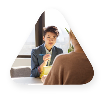 Woman taking notes in an interview