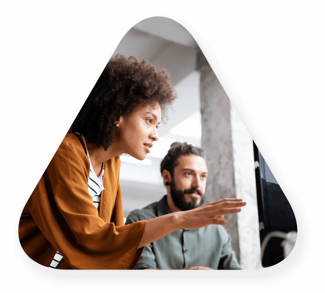A woman showing a man technology solutions in a triangle shape